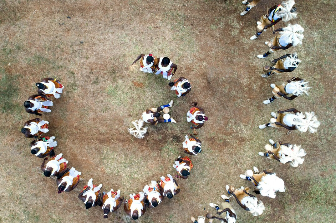 Small group of Brazilian people discussing in a circle during a workshop